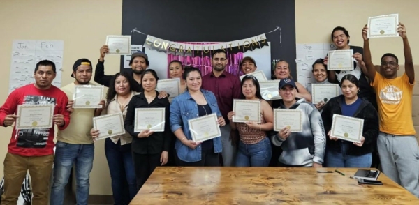One of our ESOL classes during their graduation celebration this June!